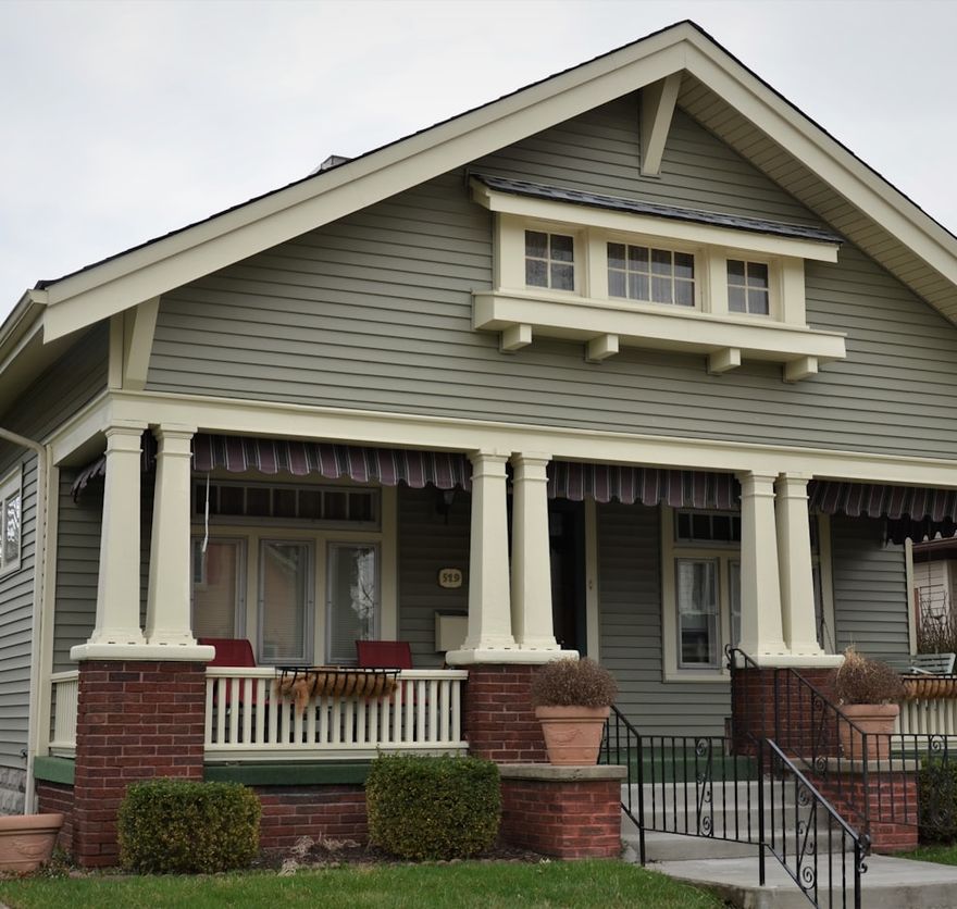 Craftsman bungalow with brick porch columns and deep eaves